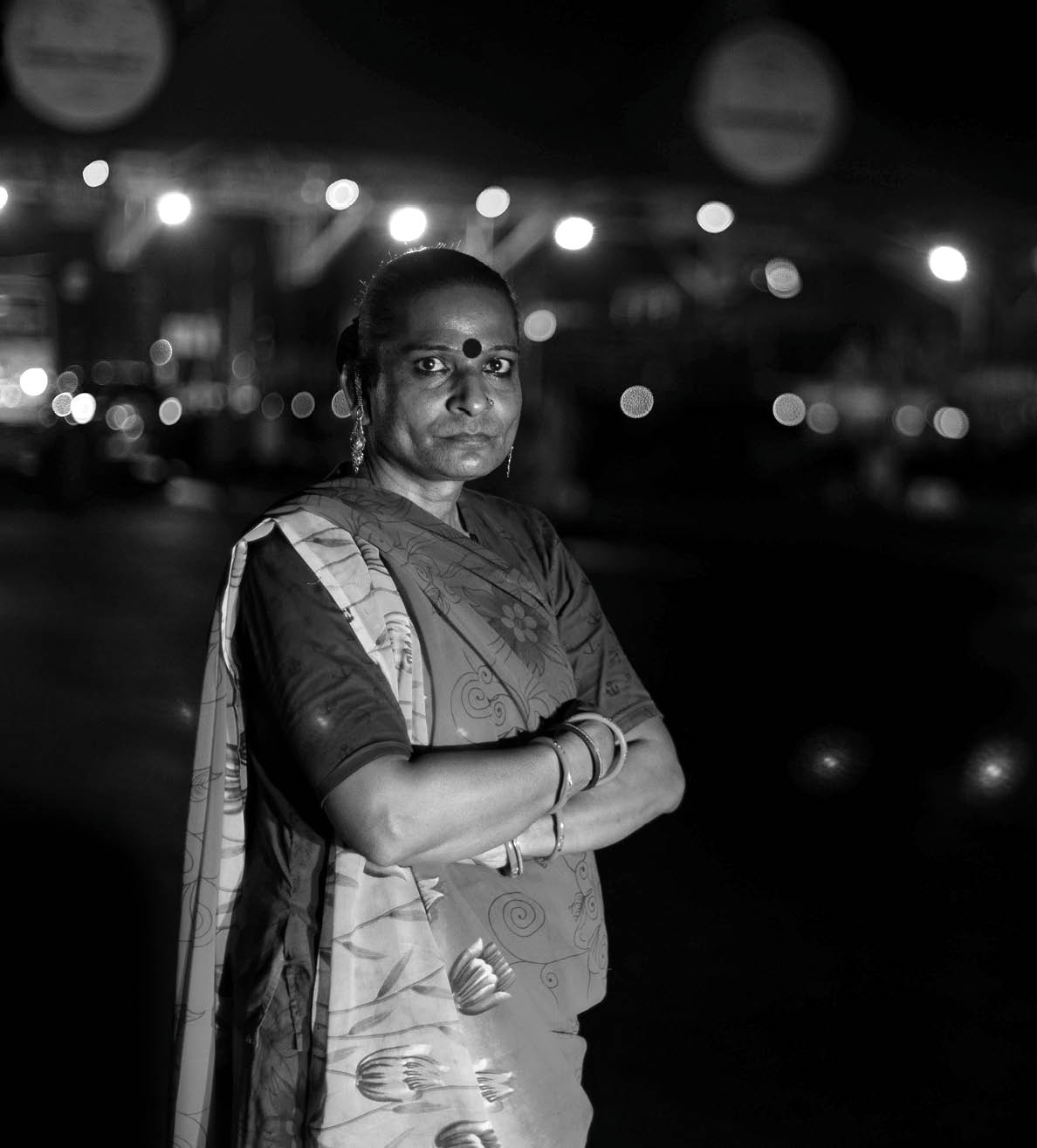 Tulsi Ram, a 41-year-old transgender woman, poses for a photograph as she waits for vehicles to stop at a toll plaza on the Ahmedabad – Mumbai highway at midnight on the outskirts of the city of Surat, Gujarat, India, on 25 April 2022. The Accelerating Innovation programme, funded by the Elton John AIDS Foundation, has supported marginalised communities during the COVID-19 pandemic in India.