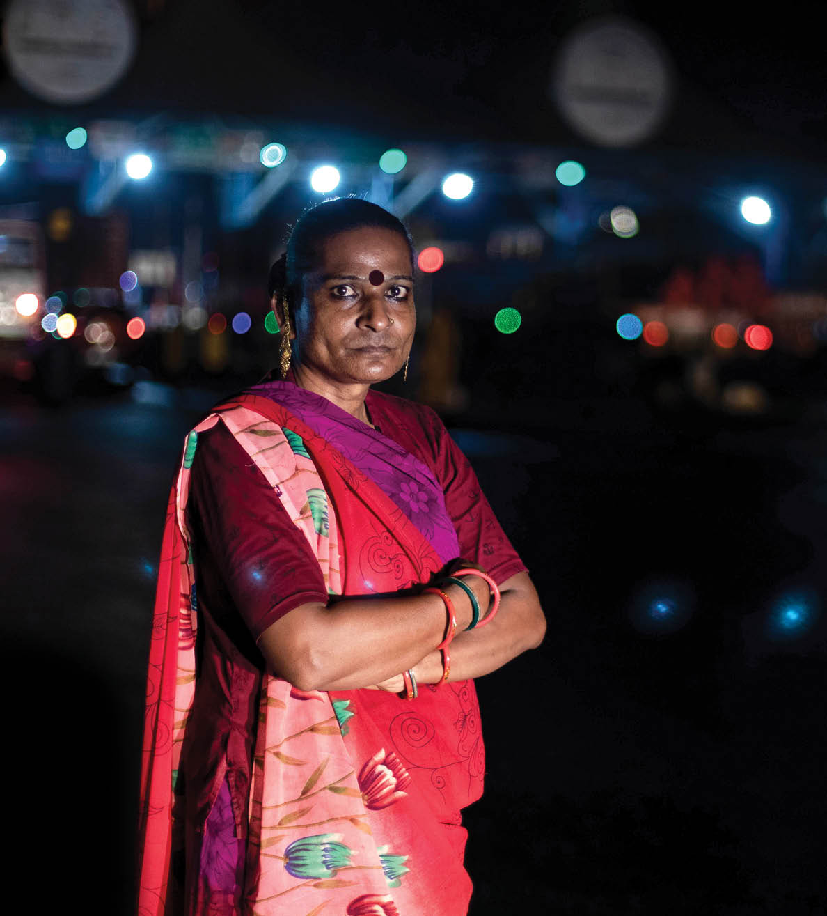 Tulsi Ram, a 41-year-old transgender woman, poses for a photograph as she waits for vehicles to stop at a toll plaza on the Ahmedabad – Mumbai highway at midnight on the outskirts of the city of Surat, Gujarat, India, on 25 April 2022. The Accelerating Innovation programme, funded by the Elton John AIDS Foundation, has supported marginalised communities during the COVID-19 pandemic in India.