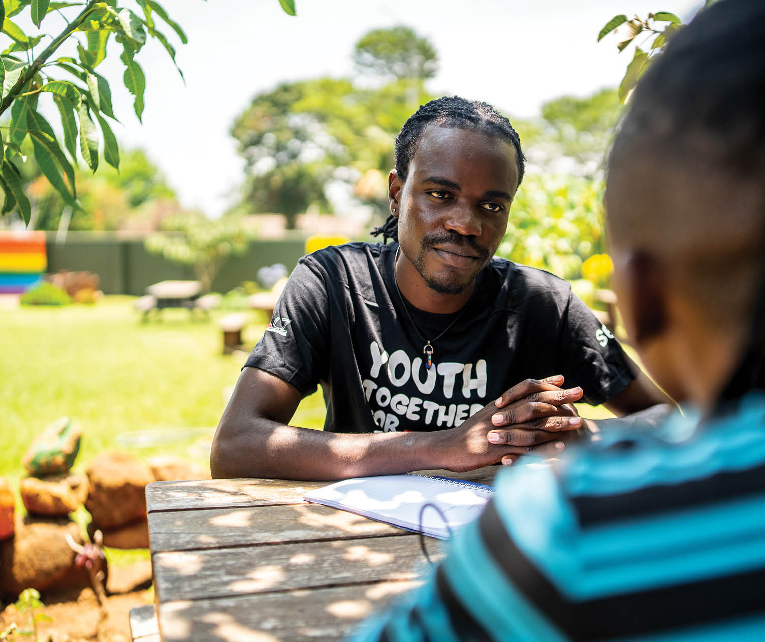 Robert, an Ordaa Advocate, provides advice on HIV and sexual and reproductive health and rights to Divine, a community member, at GALZ’s wellness centre in Harare, Zimbabwe.