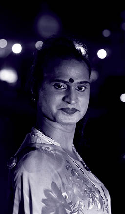 A transgender woman poses for a photograph as she waits for vehicles to stop at a toll plaza on the Ahmedabad – Mumbai highway at midnight on the outskirts of the city of Surat, Gujarat, India, on 25 April 2022. The Accelerating Innovation programme, funded by the Elton John AIDS Foundation, has supported marginalised communities during the COVID-19 pandemic in India.