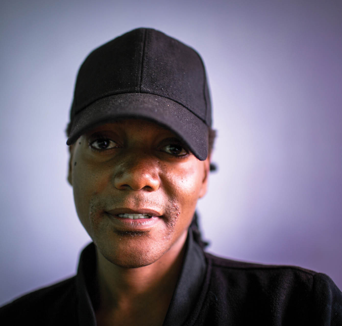 Jomell M’hango, a 28 year old DZL client, sits in his house in John Laing Compound, Lusaka Zambia on 25 November 2020. Frontline AIDS, in partnership with the Elton John AIDS Foundation, has created a COVID-19 Emergency Fund, which enables healthcare workers from Dignitate Zambia’s (DZL), a Zambia-based community organisation, to offer mobile outreach care support to communities most affected by HIV. The mobile support entails HIV testing, food and grocery supplies, and counselling support for those struggling with the lockdown restrictions as well as survivors of gender-based and domestic violence.