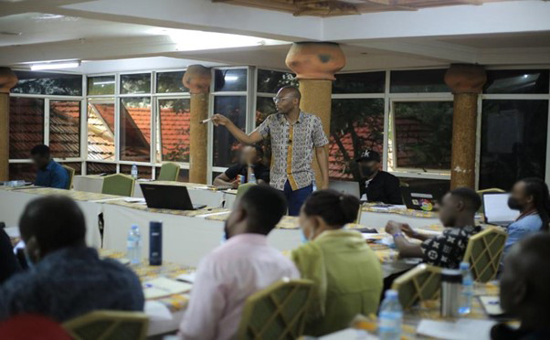 A man facilitates a sensitisation session with journalists